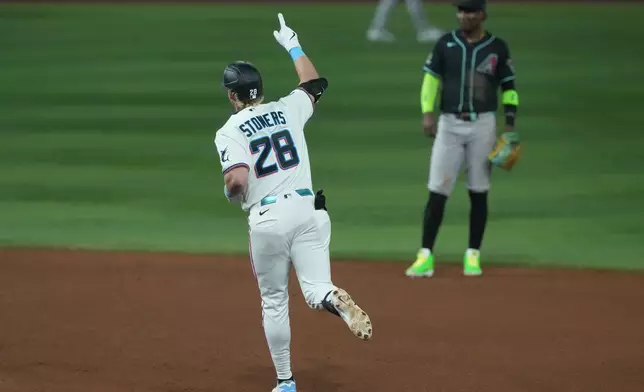 Miami Marlins' Kyle Stowers (28) runs the bases after hitting a three-run home run during the fourth inning of a baseball game against the Arizona Diamondbacks Wednesday, June 10, 2026, in Miami. (AP Photo/Marta Lavandier)