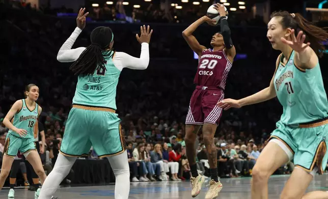 Toronto Tempo guard Brittney Sykes (20) shoots the ball during the second half of a WNBA basketball game against the New York Liberty, Wednesday, June 3, 2026, in New York. (AP Photo/Heather Khalifa)