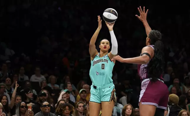 New York Liberty forward Satou Sabally (0) shoots over Toronto Tempo forward Nyara Sabally during the first half of a WNBA basketball game, Wednesday, June 3, 2026, in New York. (AP Photo/Heather Khalifa)