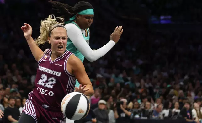 Toronto Tempo guard Julie Allemand (22) collides with New York Liberty center Jonquel Jones during the second half of a WNBA basketball game, Wednesday, June 3, 2026, in New York. (AP Photo/Heather Khalifa)