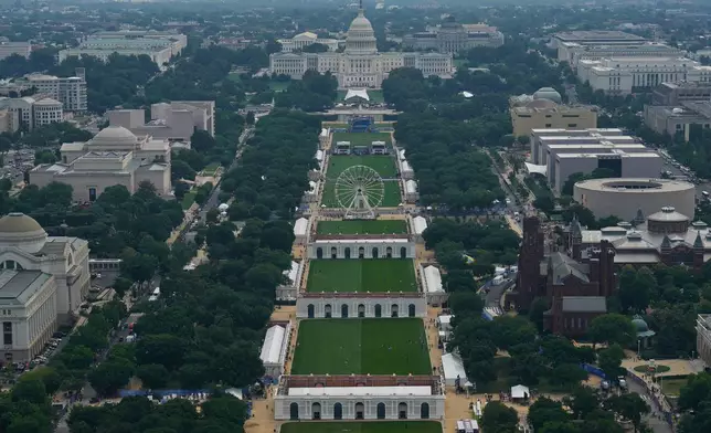 The Freedom 250 Ferris Wheel and the U.S. Capitol are seen on the National Mall from the Washington Monument during the Great American State Fair on Friday, June 26, 2026, in Washington. (AP Photo/Carolyn Kaster)