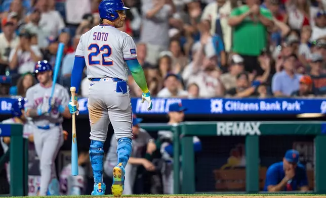 New York Mets' Juan Soto looks back after striking out during the eighth inning of a baseball game against the Philadelphia Phillies, Sunday, June 21, 2026, in Philadelphia. (AP Photo/Chris Szagola)
