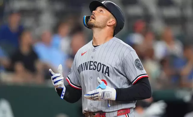 Minnesota Twins' Trevor Larnach celebrates his home run during the fourth inning of a baseball game against the Texas Rangers, Thursday, June 18, 2026, in Arlington, Texas. (AP Photo/LM Otero)