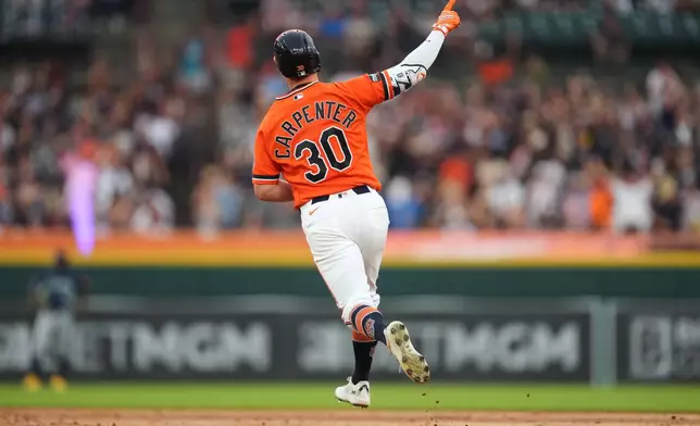 Detroit Tigers' Kerry Carpenter reacts to his two-run home run against the Seattle Mariners during the third inning of a baseball game Friday, June 5, 2026, in Detroit. (AP Photo/Paul Sancya)