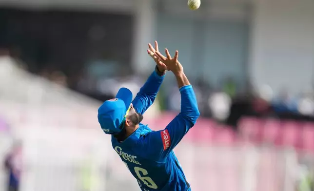 Afghanistan's Ikram Alikhil takes the catch to dismiss India's Ishan Kishan during the second ODI cricket match between India and Afghanistan in Lucknow, India, Wednesday, June 17, 2026. (AP Photo/Manish Swarup)