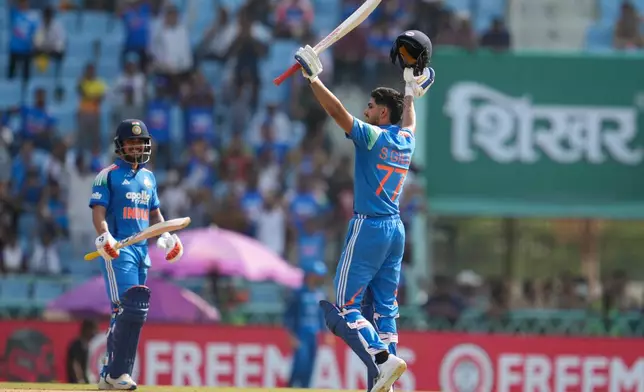 India's captain Shubman Gill, right, celebrates his century as India's Ishan Kishan looks on during the second ODI cricket match between India and Afghanistan in Lucknow, India, Wednesday, June 17, 2026. (AP Photo/Manish Swarup)