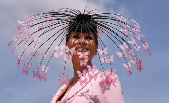 Racegoer Isabell Kristensen poses for photographers on the first day of the Royal Ascot horse race meeting in Ascot, England, Tuesday, June 16, 2026.(AP Photo/Kin Cheung)