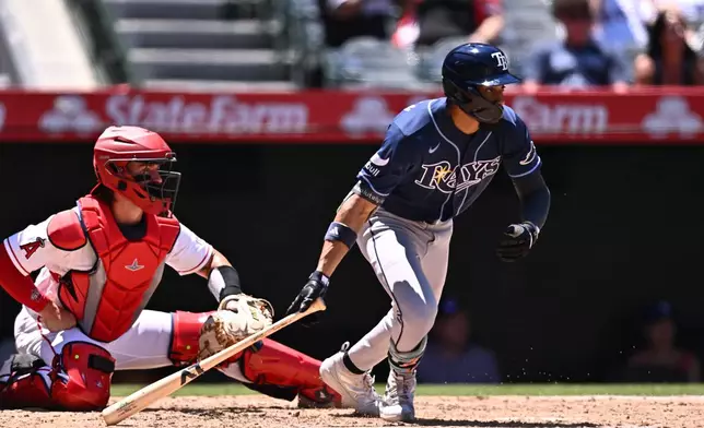 Tampa Bay Rays' Chandler Simpson hits an RBI single during the third inning of a baseball game against the Los Angeles Angels, Sunday, June 14, 2026, in Anaheim, Calif. (AP Photo/William Liang)