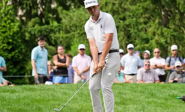 J.T. Poston chips onto the sixth green during the third round of the Memorial golf tournament, in Dublin, Ohio, Saturday, June 6, 2026. (AP Photo/Sue Ogrocki)