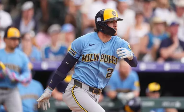 Milwaukee Brewers' Brice Turang breaks from the batter's box after connecting for a single to drive in two runs off Colorado Rockies relief pitcher Jaden Hill in the sixth inning of a baseball game Sunday, June 7, 2026, in Denver. (AP Photo/David Zalubowski)