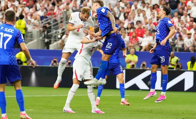 England's Harry Kane (9) heads the ball and scores a goal during the World Cup Group L soccer match between England and Croatia in Arlington, Texas, near Dallas, Wednesday, June 17, 2026. (AP Photo/Tony Gutierrez)