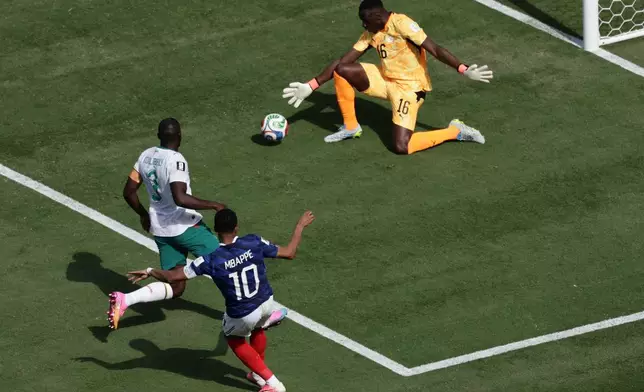 France's Kylian Mbappe scores during the World Cup Group I soccer match between France and Senegal in East Rutherford, N.J., near New York, Tuesday, June 16, 2026. (AP Photo/Adam Hunger)