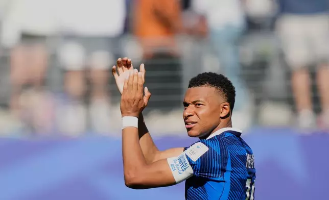 France's Kylian Mbappe applauds the fans at the end of during the World Cup Group I soccer match between France and Senegal in East Rutherford, N.J., near New York, Tuesday, June 16, 2026. (AP Photo/Yuki Iwamura)
