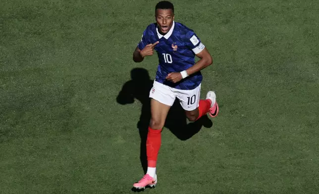 France's Kylian Mbappe celebrates after scoring thrid goal during the World Cup Group I soccer match between France and Senegal in East Rutherford, N.J., near New York, Tuesday, June 16, 2026. (AP Photo/Adam Hunger)