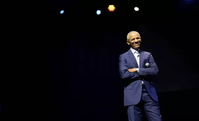 Former President Barack Obama appears on stage as he surprises administration and campaign alumni in Chicago ahead of the dedication ceremony of the Obama Presidential Center, Wednesday, June 17, 2026. (AP Photo/Pablo Martinez Monsivais, Pool)