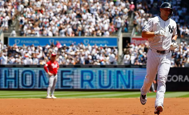 New York Yankees' Paul Goldschmidt runs the bases after hitting a home run against the Cincinnati Reds during the first inning of a baseball game, Saturday, June 20, 2026, in New York. (AP Photo/Noah K. Murray)