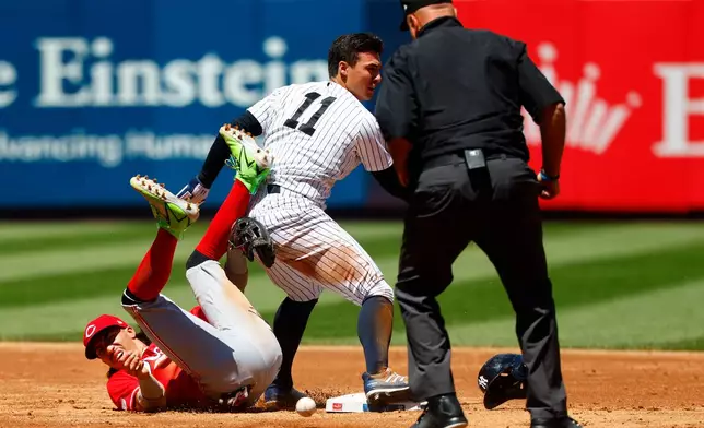 New York Yankees' Anthony Volpe (11) reacts after stealing second base against Cincinnati Reds' Edwin Arroyo (2) during the third inning of a baseball game, Saturday, June 20, 2026, in New York. (AP Photo/Noah K. Murray)
