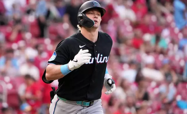 Miami Marlins' Kyle Stowers heads to first on an RBI single during the first inning of a baseball game against the St. Louis Cardinals Saturday, June 27, 2026, in St. Louis. (AP Photo/Jeff Roberson)
