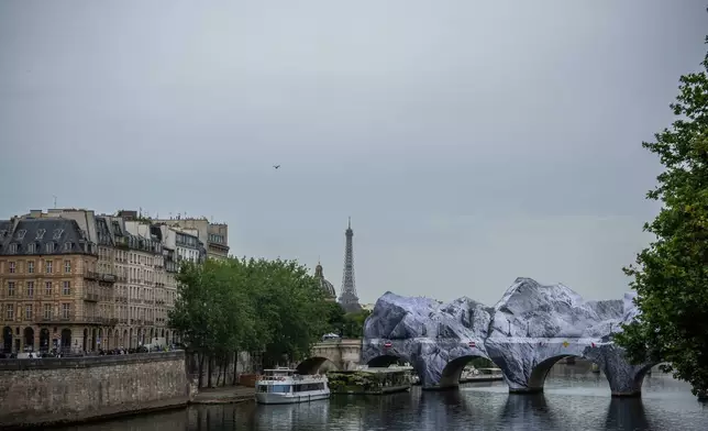 Artwork "The Pont Neuf Cave" by French street artist JR on the Pont Neuf bridge opens to the public from June 15 to 28, in Paris, Tuesday, June 16, 2026. (AP Photo/Aurelien Morissard)