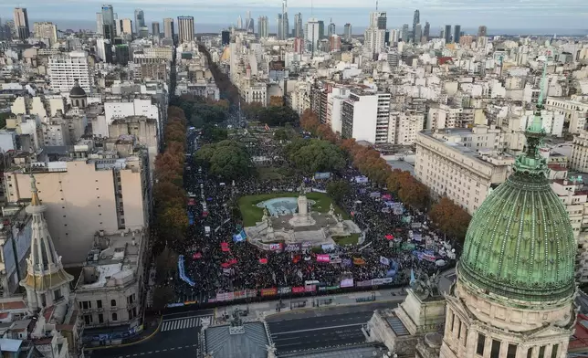 Demonstrators gather outside Congress during a march marking the anniversary of the "Ni Una Menos" (Not One Fewer) women's movement in Buenos Aires, Argentina, Wednesday, June 3, 2026. (AP Photo/Natacha Pisarenko)