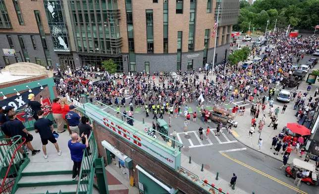 Scotland soccer fans take part in the Tartan Army March, making their way to Fenway Park ahead of a baseball game between the Boston Red Sox and the Texas Rangers, Sunday, June 14, 2026, in Boston. (AP Photo/Mark Stockwell)