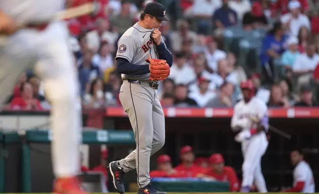 Houston Astros pitcher Kai-Wei Teng (17) walks back to the mound after giving up a 2-run double to Los Angeles Angels Wade Meckler during the second inning of a baseball game Tuesday, June 9, 2026, in Anaheim, Calif. (AP Photo/Scott Strazzante)