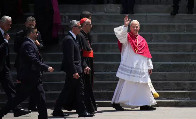 Pope Leo XIV waves to the cheering crowd after attending a midday prayer at the Cathedral of the Holy Cross and Saint Eulalia in Barcelona, Spain, Tuesday, June 9, 2026. (AP Photo/Emilio Morenatti)