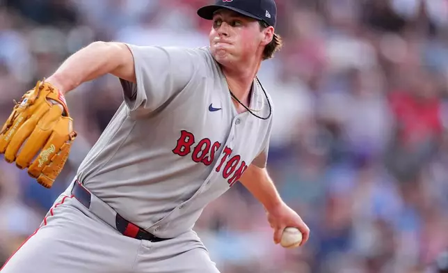 Boston Red Sox starting pitcher Jake Bennett works against the Colorado Rockies in the first inning of a baseball game Monday, June 22, 2026, in Denver. (AP Photo/David Zalubowski)