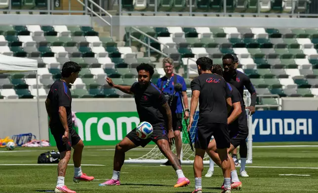 United States' Weston McKennie, center, and teammates attend a training session ahead of their FIFA World Cup match against Paraguay at its World Cup soccer tournament training base in Irvine, Calif., Thursday, June 11, 2026. (AP Photo/Andre Penner)