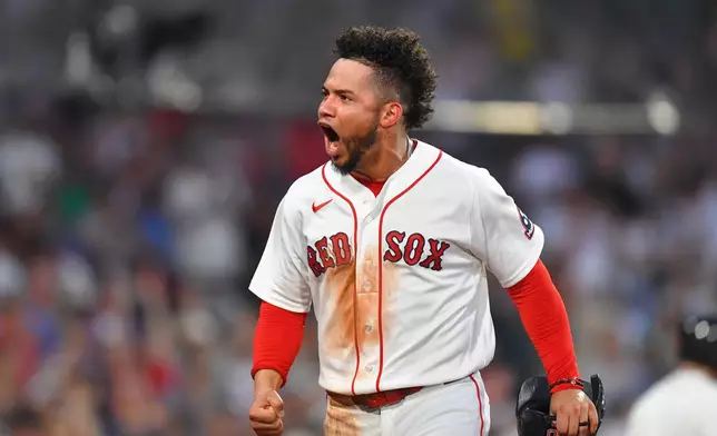 Boston Red Sox's Willson Contreras celebrates after scoring on a two-run single by Caleb Durbin in the fourth inning of a baseball game against the New York Yankees, Sunday, June 28, 2026, in Boston. (AP Photo/Steven Senne)