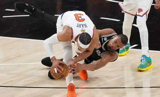 New York Knicks guard Josh Hart (3) steals the ball from San Antonio Spurs forward Victor Wembanyama during the second half of Game 1 of the NBA Finals basketball series, Wednesday, June 3, 2026, in San Antonio. (AP Photo/Eric Gay)
