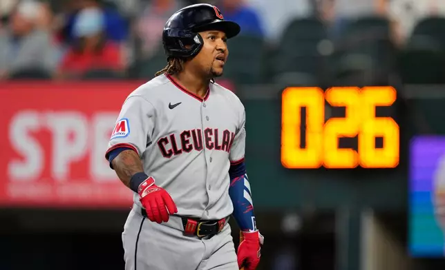 Cleveland Guardians' José Ramírez walks to the dugout after being called out on strikes in the first inning of a baseball game againts the Texas Rangers in Arlington, Texas, Sunday, June 7, 2026. (AP Photo/Tony Gutierrez)