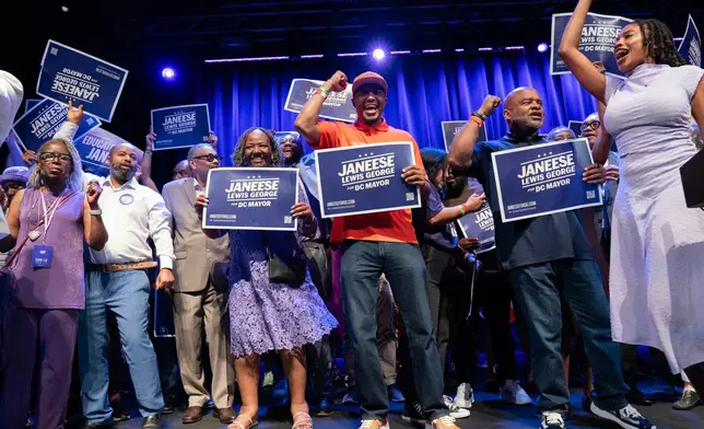 Supporters celebrate after D.C. Council member Janeese Lewis George won the D.C. Mayor primary election during an election night party at the Howard Theatre, Tuesday, June 16, 2026, in Washington. (AP Photo/Jose Luis Magana)
