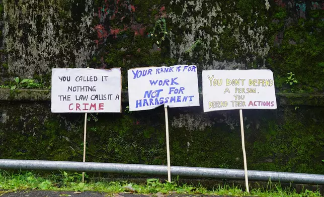 Placards are left leaning on a wall during a protest against rising cases of sexual violence against women and demanding justice for victims, in Kohima, capital of the northeastern Indian state of Nagaland, Friday, June 19, 2026. (AP Photo/Yirmiyan Arthur)