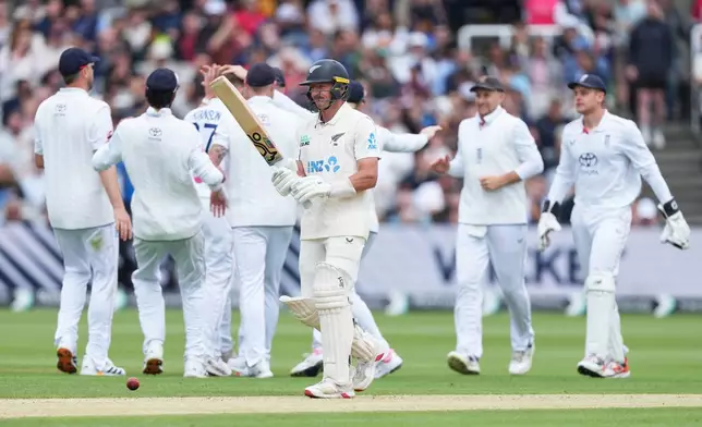 New Zealand's Nathan Smith reacts as he walks off the field after losing his wicket during the fourth day of the Test match between England and New Zealand at Lord's cricket ground in London, Sunday, June 7, 2026. (AP Photo/Kirsty Wigglesworth)