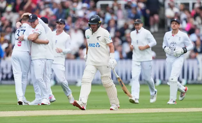 New Zealand's Nathan Smith reacts as he walks off the field after losing his wicket during the fourth day of the Test match between England and New Zealand at Lord's cricket ground in London, Sunday, June 7, 2026. (AP Photo/Kirsty Wigglesworth)