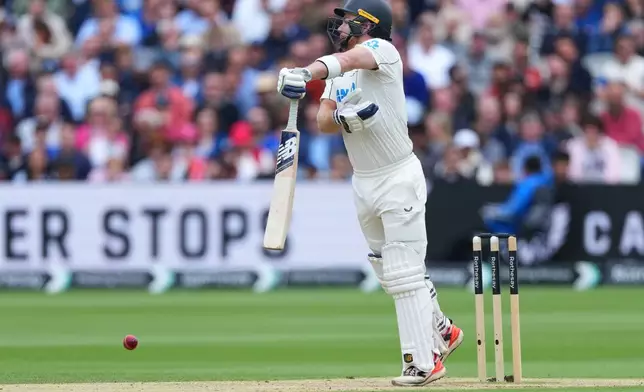 New Zealand's Glenn Phillips plays a shot during the fourth day of the Test match between England and New Zealand at Lord's cricket ground in London, Sunday, June 7, 2026. (AP Photo/Kirsty Wigglesworth)
