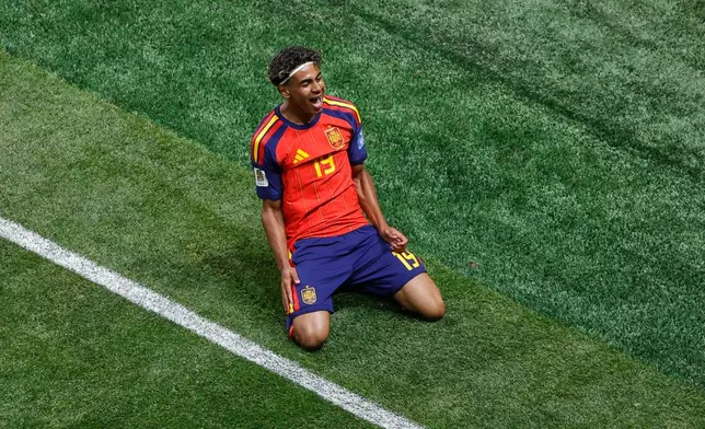 Spain's Lamine Yamal celebrates after scoring the opening goal against Saudi Arabia during the World Cup Group H soccer match in Atlanta, Sunday, June 21, 2026. (AP Photo/Butch Dill)