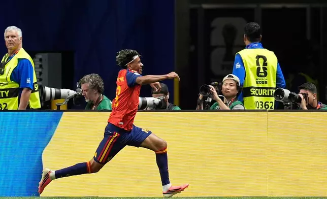 Spain's Lamine Yamal celebrates after scoring the opening goal during the World Cup Group H soccer match between Spain and Saudi Arabia in Atlanta, Sunday, June 21, 2026. (AP Photo/Mike Stewart)