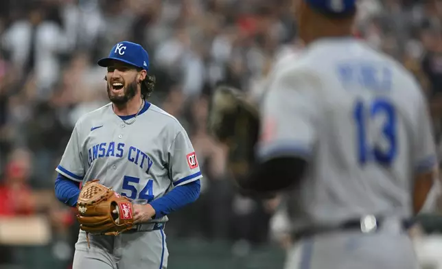 Kansas City Royals relief pitcher Mitch Spence (54) reacts after Chicago White Sox's Kyle Teel scored on a Chase Meidroth single during the third inning of a baseball game in Chicago, Friday, June 26, 2026. (AP Photo/Paul Beaty)