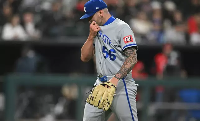 Kansas City Royals relief pitcher Alex Lange reacts while walking to the dugout after being pulled from the game during the seventh inning of a baseball game against the Chicago White Sox in Chicago, Friday, June 26, 2026. (AP Photo/Paul Beaty)