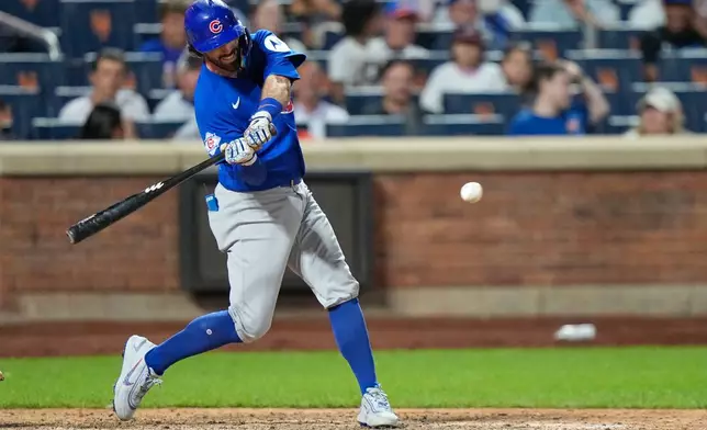 Chicago Cubs' Dansby Swanson hits a two-run single during the ninth inning in the second baseball game of a doubleheader against the New York Mets Wednesday, June 24, 2026, in New York. (AP Photo/Frank Franklin II)