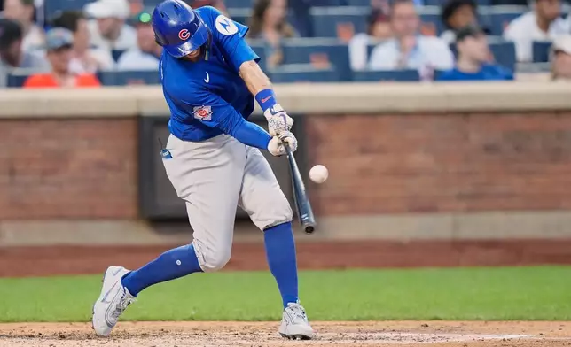 Chicago Cubs' Dansby Swanson (7) hits an RBI single during the fourth inning in the second baseball game of a doubleheader against the New York Mets Wednesday, June 24, 2026, in New York. (AP Photo/Frank Franklin II)