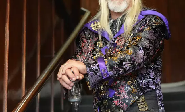 Steampunk NZ Festival attendee Carl Yates, dressed as his steampunk persona Sir Gideon Steamcrank, poses for a portrait during the annual event in Ōamaru, New Zealand, Friday, May 29, 2026. (AP Photo/Charlotte Graham-McLay)