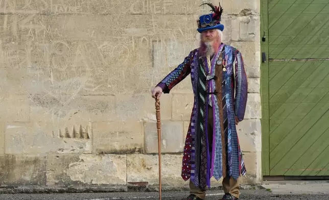 Steampunk NZ Festival attendee Alan Bryan, wearing a coat he made from old ties, poses for a portrait during the annual event in Ōamaru, New Zealand, Saturday, May 30, 2026. (AP Photo/Charlotte Graham-McLay)