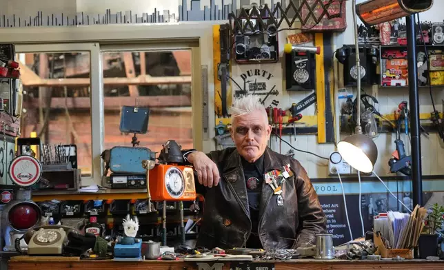 Artist Martin Horspool poses in his store at the Victorian precinct in Ōamaru, New Zealand, Friday, May 29, 2026. (AP Photo/Charlotte Graham-McLay)
