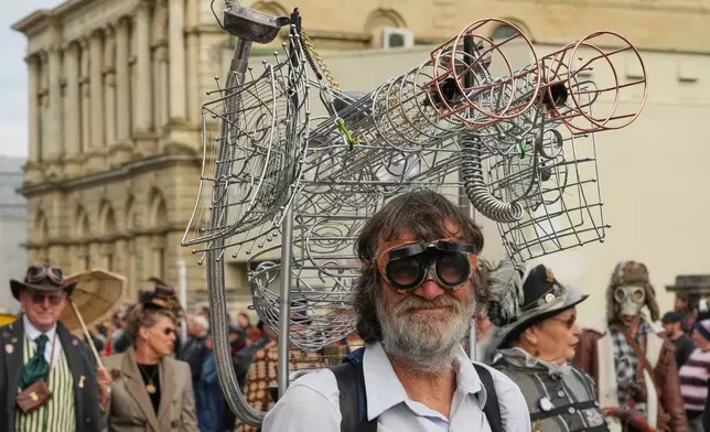 A participant reacts as he marches in a parade at the Steampunk NZ Festival in Ōamaru, New Zealand, on May 30 2026. (AP Photo/Charlotte Graham-McLay)