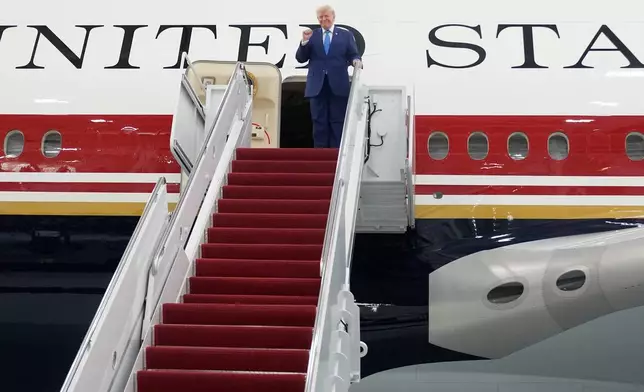 President Donald Trump exits the newly designated Air Force One presidential aircraft following a tour at Joint Base Andrews, Md., Friday, June 19, 2026. (AP Photo/Manuel Balce Ceneta)