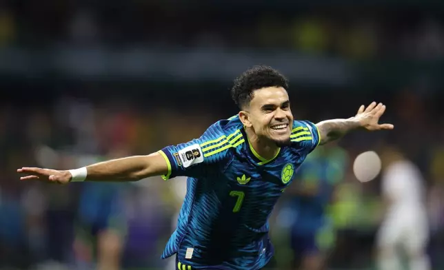 Colombia's Luis Diaz (7) celebrates after scoring his team's second goal during the World Cup Group K soccer match between Uzbekistan and Colombia in Mexico City, Wednesday, June 17, 2026. (AP Photo/Ashtin Barker)