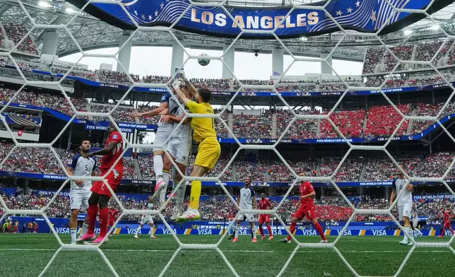 Bosnia goalkeeper Nikola Vasilj (1) punches the ball away during the World Cup Group B soccer match between Switzerland and Bosnia in Inglewood, Calif., near Los Angeles, Thursday, June 18, 2026. (AP Photo/Andre Penner)